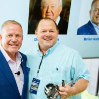 Brian Kelly posing with a guest at the Jamie Hosford Football Center dedication.